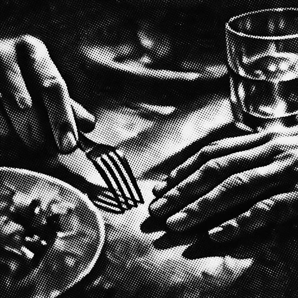 Hands interacting over a dining table